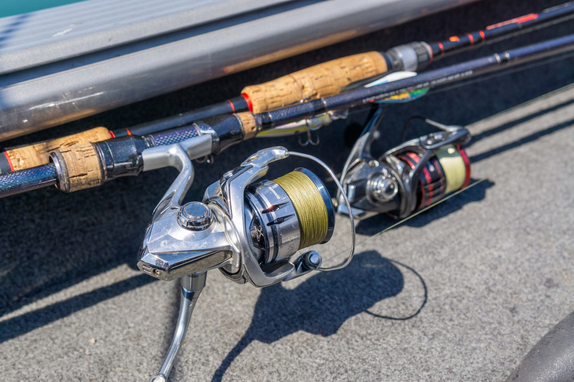 Closeup shot of two fishing poles. The pole in view is lined with Cortland Master Braid Bronze.