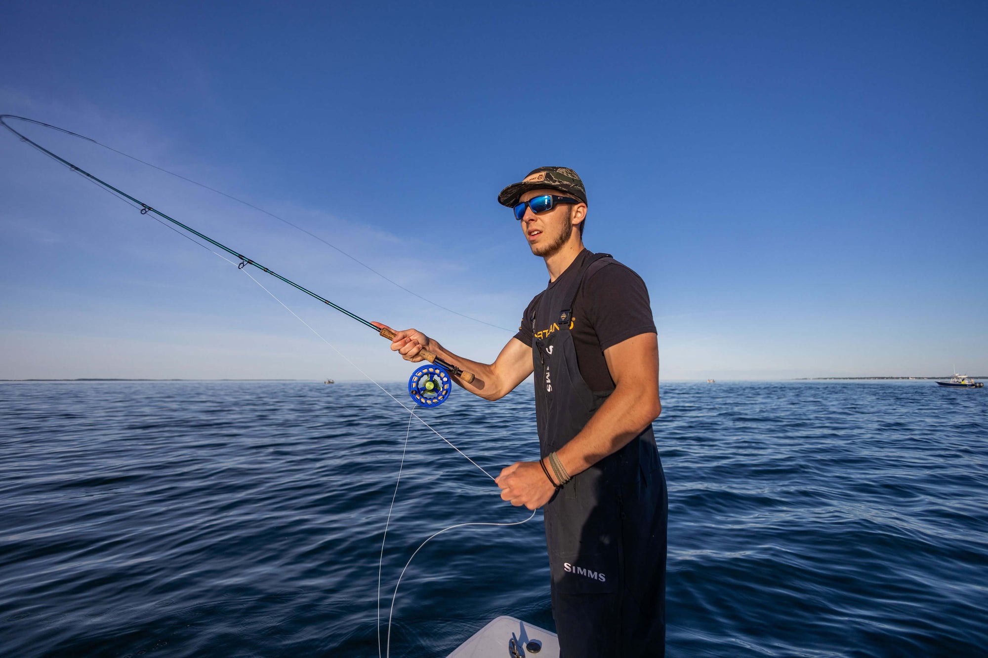 A man is getting ready to cast his fly line. 