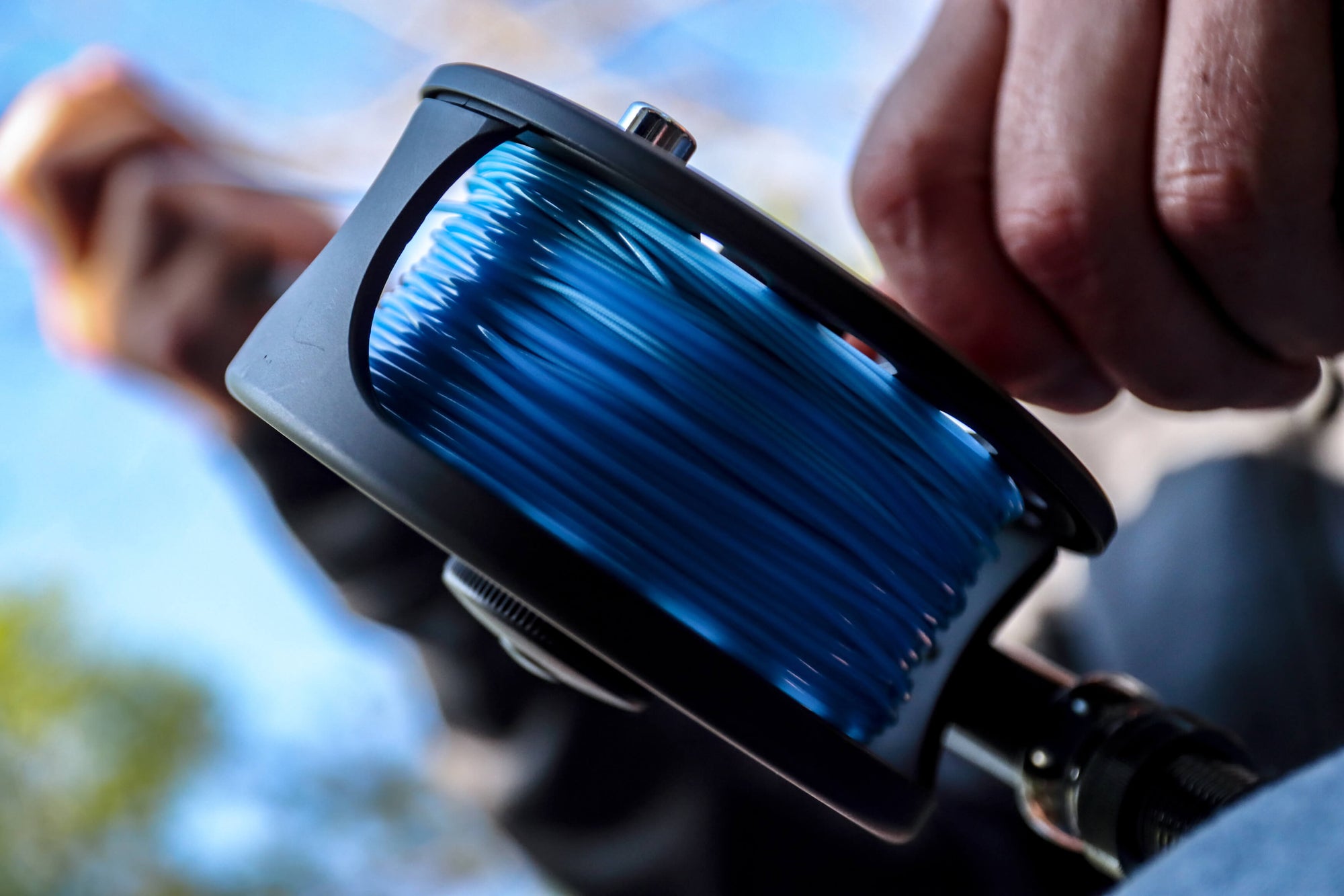 A fly reel is lined with Striped Bass Blitz