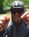 Angler tying a knot in his fly fishing tippet